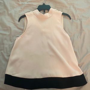 Beige blouse that can be tied in the back.